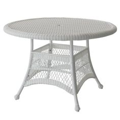 a white wicker table with an oval top