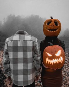 two people with pumpkin heads on their backs