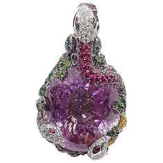 Kunzite 123.73 carats, Ruby, Blue Sapphire, Tsavorite 18.0 carats with Diamond 1.95 carats Pendants set in 18 Karat White Gold Settings (chain not included) Width: 3.0 cm Length: 5.6 cm Total Weight: 55.31 grams "We first opened doors in 1980 when it was then situated in the vicinity of the Victory Monument; a small and modest storefront with a couple of counters. From its humble beginnings to where it stands today, our company has proven its abilities as a jeweler. Since the beginning, we have been supplying fine quality pieces to dealers, wholesalers and customers worldwide. From then till now, our business still interrelates its name with quality products and excellent service, where commitment and sincerity toward customers will always be its motto." Gold Pendants, Diamond Pendants, Pendant Set, Diamond Pendant, Gold Pendant, Blue Sapphire, Monument, Jewelry Necklace Pendant, Ruby