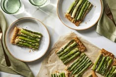 asparagus and cheese tarts on plates with forks