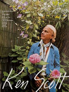 a magazine cover with a man holding flowers