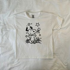 Screen printed on a made to order basis. Handmade with silk screen process, tops may have minor imperfections!⛄️ (I use Gildan Unisex Youth tees for that perfect baby tee look) 100% Cotton ⚠️ -Machine wash cold and hand washing is preferred but not required -please do not iron or bleach -all sales are final Stars Y2k, Aesthetic Graphic Tees, Sanrio Graphic Tee, Snoopy Baby, White Vintage T-shirt With Cartoon Print, Snoopy Tshirt, Snoopy Graphic Tee, Peanuts T Shirts, Snoopy Shirt