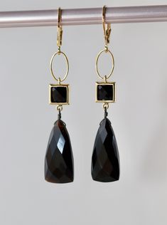 "Faceted Black Onyx Triangle shape stones size 20 x 10 mm. Square Connectors with Black Synthetic Faceted Glass Stones 7 x 7 mm in Gold plated over the brass setting.  Gold plated Lever Back Clasps. The total length is 2.25 inches or 58 mm long.  Your order will be gift wrapped and shipped in jewelry gift box.  If you would like to order this item as a gift you can leave a personalized note for the receiver during a checkout process, there will be \"Gift  details\" option to add a message. * * * Black Onyx Earrings For Parties, Black Faceted Teardrop Jewelry, Black Faceted Jewelry For Party, Black Faceted Earrings As A Gift, Faceted Black Earrings Gift, Elegant Onyx Earrings For Party, Elegant Black Faceted Earrings, Formal Black Onyx Earrings, Staple Necklace