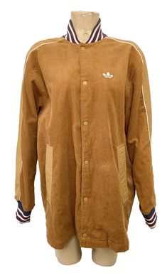 Very nice Men's Adidas jacket size medium. It's dark beige corduroy with blue, white and red around the neck and arm openings. There are pockets. Snaps down the front. Very nice. NWT priced $120.00. No defects that I can see. Message me with any questions or if more measurements are needed.  Always check measurements  Approximate measurements: chest: 24" armpit to armpit, length: 27" top of shoulder to bottom side. Tag reads: 100% polyester Feel free to check out my other items! Happy to combine shipping! Must combine shipping prior to payment.  Matching Prices: For all store listings I will match prices!! Just send me a link or an item number for the same item that is listed cheaper here on eBay!! ***International buyers: I cannot ship directly to other countries, but I will use eBays new Casual Brown Outerwear With Ribbed Collar, Brown Cotton Outerwear With Ribbed Collar, Brown Hooded Corduroy Outerwear, Brown Corduroy Outerwear For Streetwear, Corduroy Button-up Outerwear For Streetwear, Beige Corduroy Collared Outerwear, Beige Collared Corduroy Outerwear, Adidas Cotton Outerwear With Ribbed Cuffs, Beige Corduroy Jacket