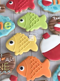 decorated cookies are displayed on a table