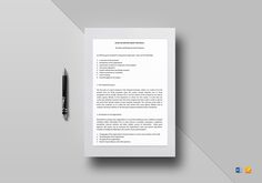 a letterhead with a pen on top of it next to a paper that says,