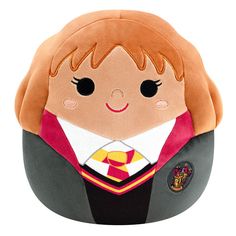 a harry potter plush toy with a hogwarts uniform on it's head