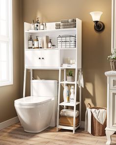 a white toilet sitting next to a bath tub in a bathroom on top of a wooden floor