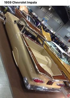 an old car is on display in a showroom