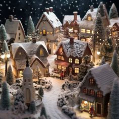 a christmas village with lit up houses and trees