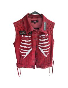 "Punk's not dead--and neither is your rebellious spirit. Prove it with this edgy denim vest, adorned with metal studs and an iconic Misfits back patch. Its corset-inspired rib cage design cinches at the waist to create a figure-flattering silhouette you'll want to show off. When the mainstream bores you, slip into this vest and flash your defiant side. From its distressed details to the anarchy-red shade, every element screams \"question authority. The soft denim fabric lets your skin breathe while you start the revolution. Or just look like a punk pioneer at the next music festival. Either way, this vest is your ticket to the unapologetic style and attitude that once rattled the establishment. Are you ready to shake things up again? We are--one rebellious vest at a time. Nonconformists of Question Authority, Oc Outfits, Red Denim, Diy Vetement, Estilo Punk, Ropa Diy, Punk Outfits, Mode Inspo