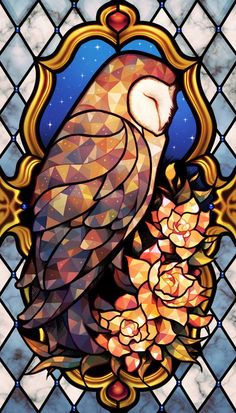 a stained glass window with an owl and flowers