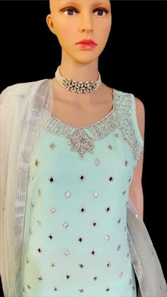 Enhance your beauty by putting on this embroidered pastel light blue color suit with a flared gharara. Densely embroidered with thread, mirrors and sequins embroidery, enriched with beads and mirror work ornaments all over. Accompanied by a matching color similarly embroidered flared gharara along with a dupatta with a lace detailed border and motifs all over. Size: L Blue Colour Suit, Pastel Light Blue, Enhance Your Beauty, Over Size, Sequins Embroidery, Mirror Work, Light Blue Color, Salwar Kameez, Put On