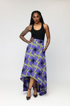 This African Print High-Low Skirt is a masterpiece of craftsmanship, blending bold African prints with modern design. The high-low hemline creates a dynamic and flattering silhouette, allowing for graceful movement and effortless style. It transitions seamlessly from casual outings to more formal occasions, making it a versatile piece in your wardrobe Styling Tips: Pair with a fitted tank top or a simple white blouse. Complete the look with sandals or flats for a relaxed yet chic appearance. Opt African Print Outfits, Black And White Models, Sophisticated Office, Embroidered Dresses, Wardrobe Styling, African Print Skirt, Graceful Movement, African Print Clothing, African Inspired Fashion