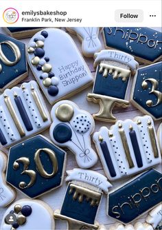 cookies decorated with royal blue and white icing are arranged in the shape of numbers