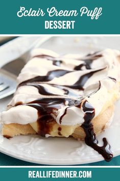 a slice of ice cream puff dessert on a white plate with chocolate drizzle