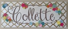 a sign that says collette with flowers on it