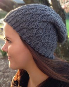 a woman wearing a gray knitted hat