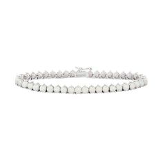 "Showcase your stunning sense of style when you don this captivating lab-created opal tennis bracelet.BRACELET DETAILS Length: 7.25 in. Clasp: box Metal: rhodium-plated sterling silver STONE DETAILS Stone type: lab-created opal Total weight: 10 3/4 ct. Shape: round Setting: prong  Size: 7.25"". Color: White. Gender: female. Age Group: adult." White Flexible Tennis Bracelet As Gift, Flexible White Tennis Bracelet As A Gift, Flexible White Tennis Bracelet Gift, Flexible White Tennis Bracelet For Gift, Adjustable White Tennis Bracelet, Formal White Tennis Bracelet With Jubilee Detail, Hourglass Fashion, Vintage Style Decorating, Jewelry Clasps