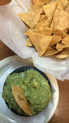 guacamole and tortilla chips on a plate