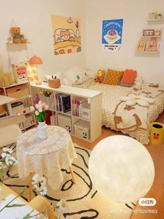 a room with a bed, desk and chair in it on the floor next to a book shelf