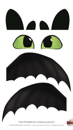 a paper mask with green eyes and black wings