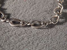 I am offering you this vintage bold sterling silver (tested positive for sterling silver 925 content) curb link charm style bracelet . This will fit tones of charms ! Perfect for the upcoming fashion season. It measures 7 1/4 inches long and approx. 1/4 inch wide, and is very convex in shape, and breathtaking. It weighs app. 8 grams in weight. This collectible bracelet came out of an estate here in Upstate New York. Buyer pays all shipping and handling fees Item ID:0001757 Silver Oval Link Charm Bracelet Gift, Vintage Silver Curb Chain Jewelry, Vintage Silver Jewelry With Curb Chain, Elegant Silver Charm Bracelet With Curb Chain, Nickel Free Silver Oval Link Charm Bracelet, Nickel-free Silver Oval Link Charm Bracelet, Silver Nickel-free Oval Link Charm Bracelet, Silver Link Chain Bracelet With Charms, Silver Chain Bracelet With Vintage Charm As Gift