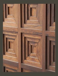 the wood paneling on this cabinet is made out of wood and has geometric designs