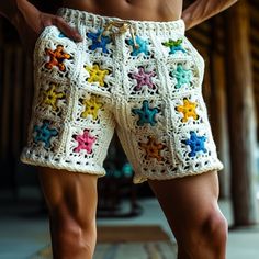 a close up of a person wearing shorts with crochet