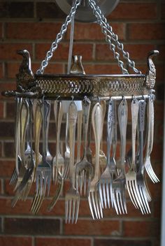 a chandelier with forks and spoons hanging from it