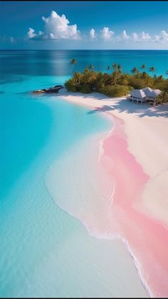 an island with pink sand and palm trees in the background, surrounded by blue water