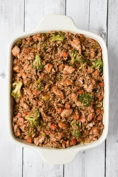 a casserole dish filled with meat and vegetables