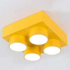 a yellow ceiling light with four lights on it