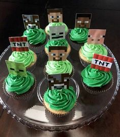 cupcakes decorated with green frosting and minecraft characters