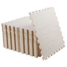 several pieces of white foam stacked on top of each other in front of a white background