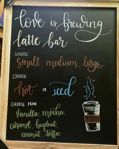 a chalkboard sign with different types of drinks written in cursive writing on it