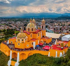 an aerial view of a city with orange buildings