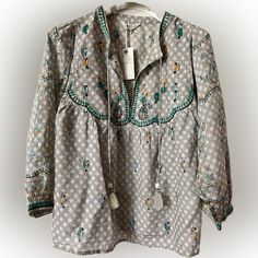 This Is The Perfect Blouse For Summer Beautiful Embroidery And Tassel Never Worn No Flaws Spring Green Blouse With Intricate Embroidery, Green Long Sleeve Top With Embroidered Neckline, Green Long Sleeve Tops With Embroidered Neckline, Spring Blouse With Multicolor Geometric Embroidery, Green Bohemian Top With Intricate Embroidery, Green Bohemian Tops With Intricate Embroidery, Bohemian Green Top With Intricate Embroidery, Bohemian Green Tops With Intricate Embroidery, Cotton V-neck Blouse With Intricate Embroidery