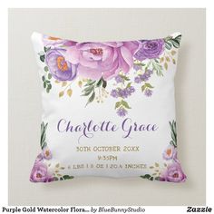 a pillow with purple flowers and greenery on the front, which reads charlotte grace