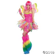 a woman dressed as a rainbow fairy holding a wand and wearing a pink outfit with multicolored feathers