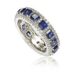 Stunning, timeless and classy eternity band ring. This ring is filled with rich, high quality stones, featuring asscher-cut blue sapphires, prong-set between two rows of white pave created white sapphires, hand set in 925 sterling silver. Every single ring is hand made, making it a unique masterpiece. Surprise someone special in your life with this luxurious anniversary ring. Or even better, this could be the perfect birthday gift. Round created white sapphires and deep blue asscher-cut sapphire Modern Eternity Band, Levian Jewelry, Sapphire Eternity Ring, Fancy Stones, Fancy Diamonds, Eternity Ring Diamond, Brown Diamond, Blue Sapphire Rings, Best Diamond