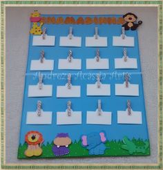 a child's activity board with animals and name tags attached to the back of it