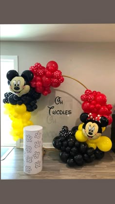 mickey and minnie mouse balloon decorations on display