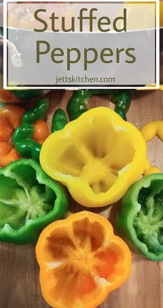 stuffed peppers on a cutting board with the words stuffed peppers above them in white lettering