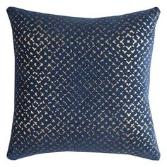 a blue and gold pillow on a white background