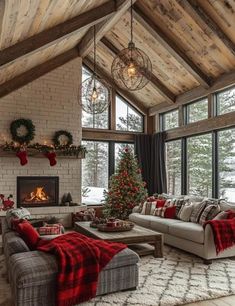 a living room filled with furniture and a christmas tree in the middle of the room