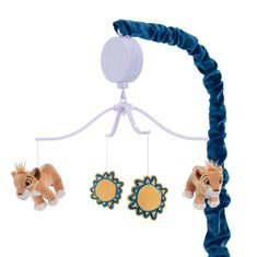 two stuffed animals hanging from a toy mobile