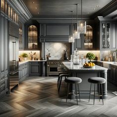 a large kitchen with gray cabinets and marble counter tops, along with two stools in front of the center island