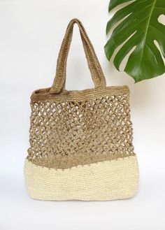 Stylish and on trend, this beautiful tote is handmade by artisans from Santander, Colombia. 100% made of Fique natural fiber, a plant similar to Agave, it is the perfect summer accessory to be used out in the city or to spend a day at the beach. With two easy to carry handles, you will want to carry it around everywhere you go!Approximate Dimensions:Height: 17" / 43 cmWidth: 16.1” / 41 cmStrap drop: 9"/ 23 cmAll of our bags are 100% handmade from natural fibers. Please allow for any color and si Bohemian Style Natural Beach Bag, Bohemian Beige Bags With Open Weave, White Open Weave Rectangular Shoulder Bag, Beige Handwoven Vacation Bag, Bohemian Natural Beach Bag For Everyday Use, Handwoven Beige Bag For Vacation, Natural Open Weave Shoulder Bag, White Rectangular Shoulder Bag With Open Weave, Handwoven Beige Vacation Bag