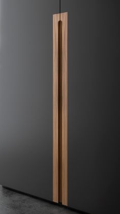 a tall wooden pole sitting in the middle of a room